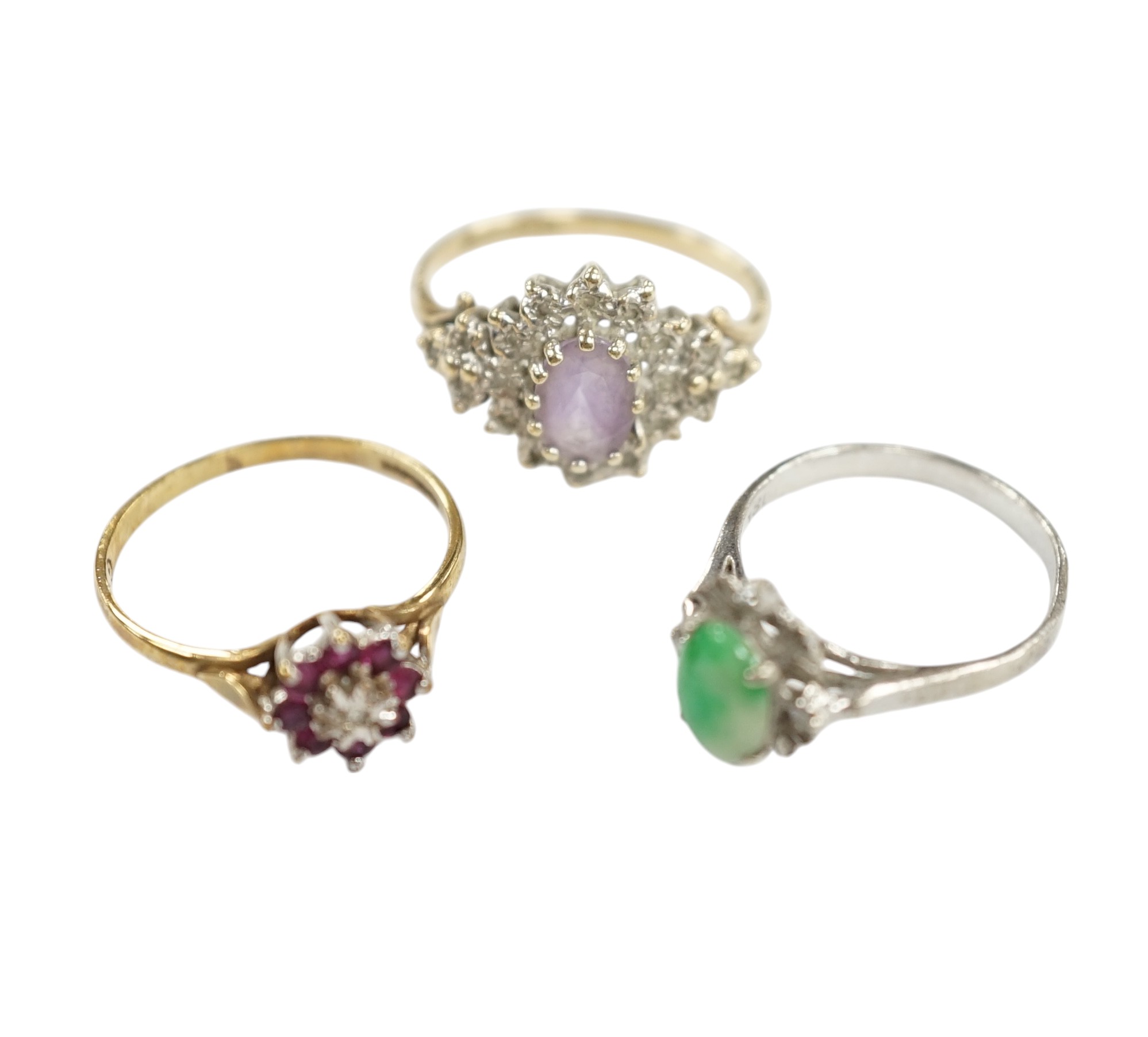 A mid 20th century 18k, jade and diamond cluster set ring, size I, gross weight 1.5 grams, together with two modern 9ct gold and gem set rings, gross weight 3.2 grams. Condition - fair